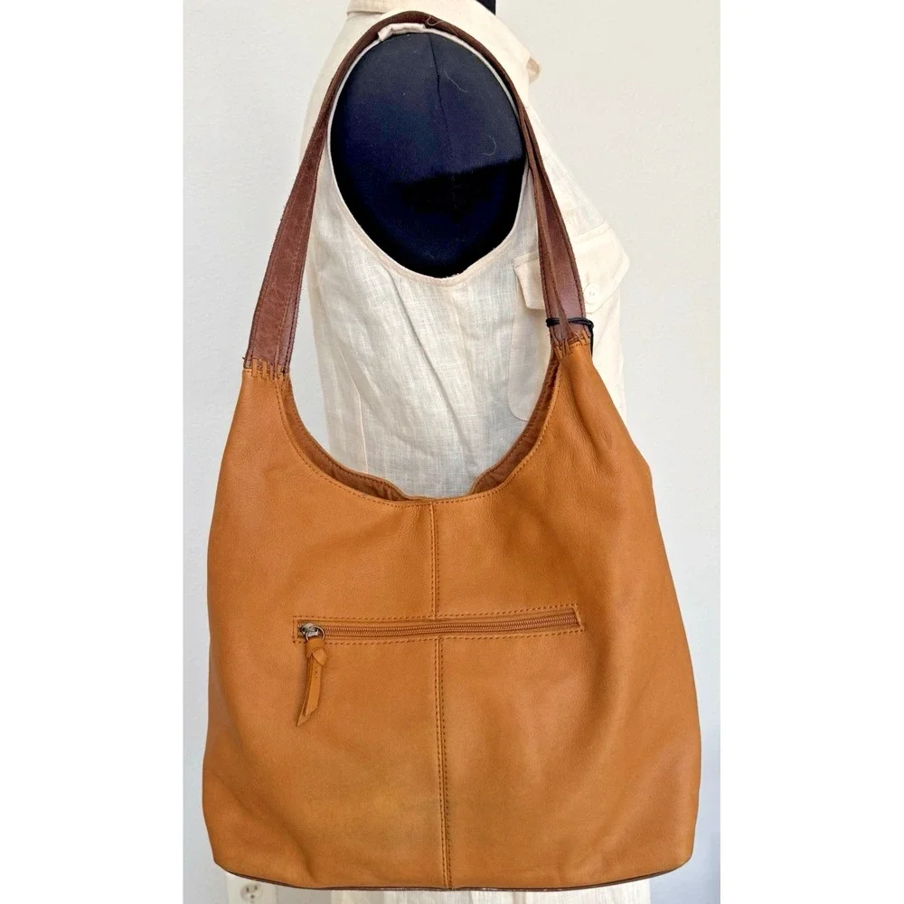 The Sak Women's Huntley‎ Leather Hobo Bag Metro Sling Pebbled Tan with Tassel